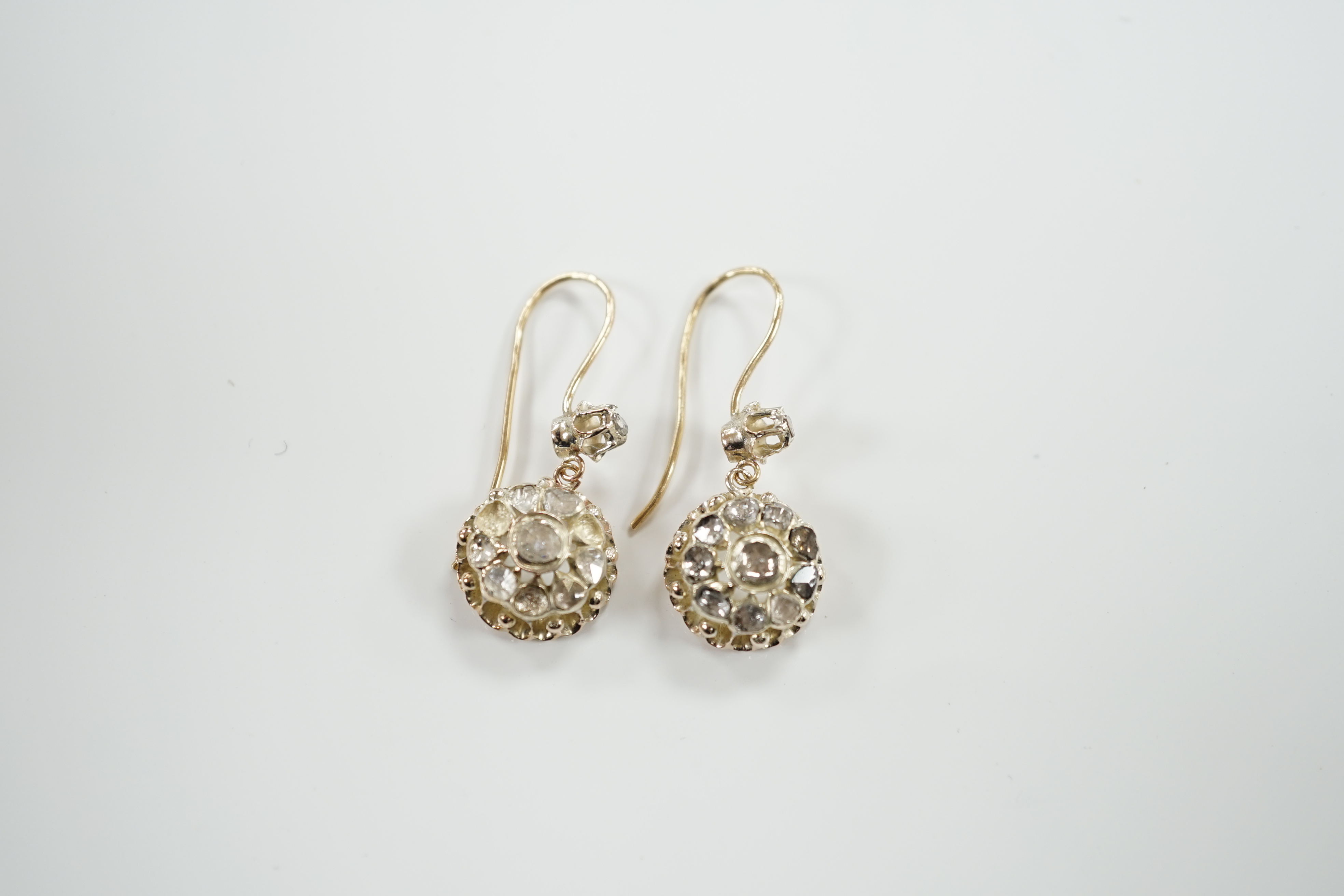 A pair of antique style yellow metal and rose cut diamond cluster set drop earrings, 24mm, gross weight 6.6 grams (stones missing).